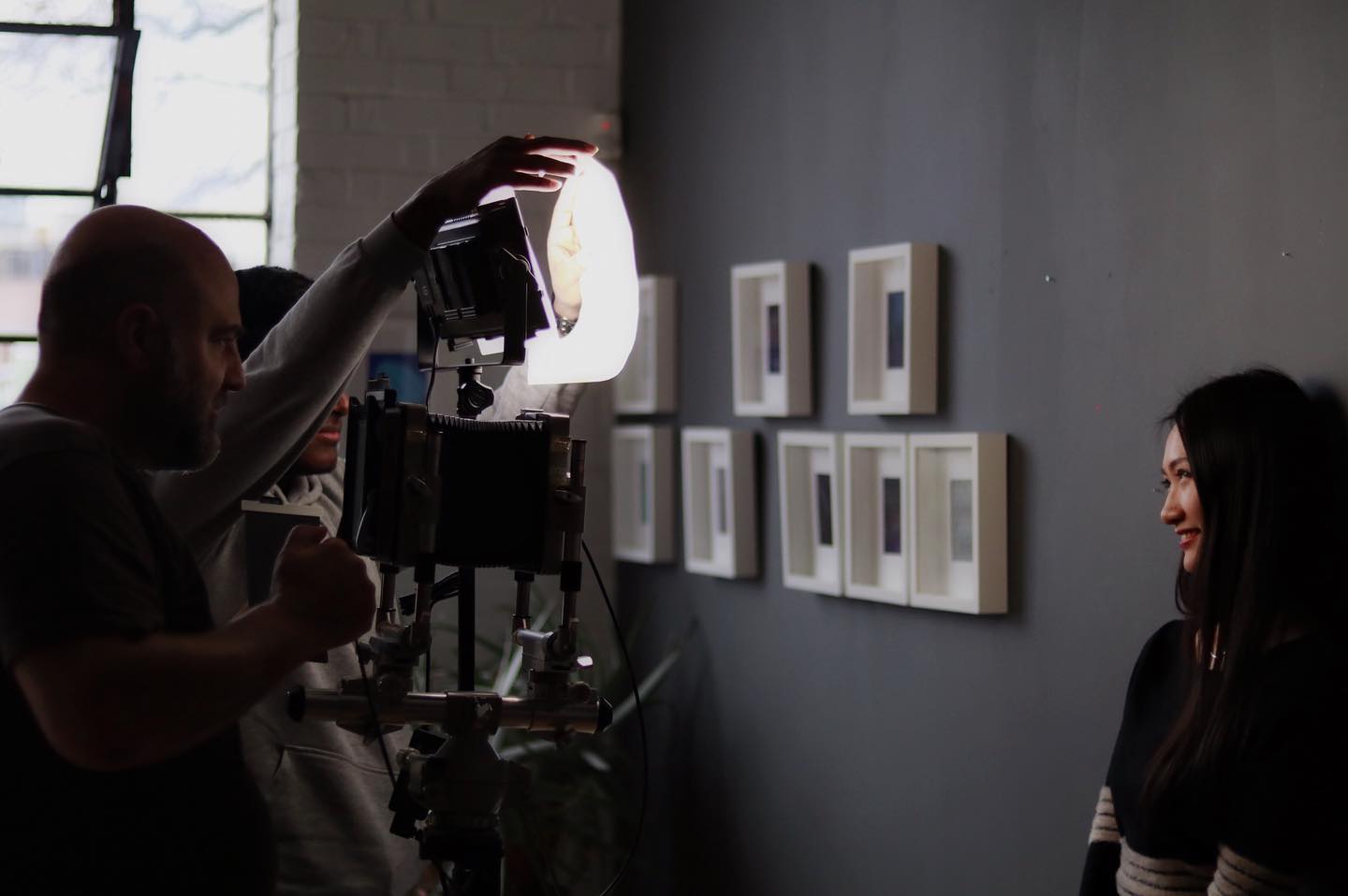 On a production set, a camera operator filming